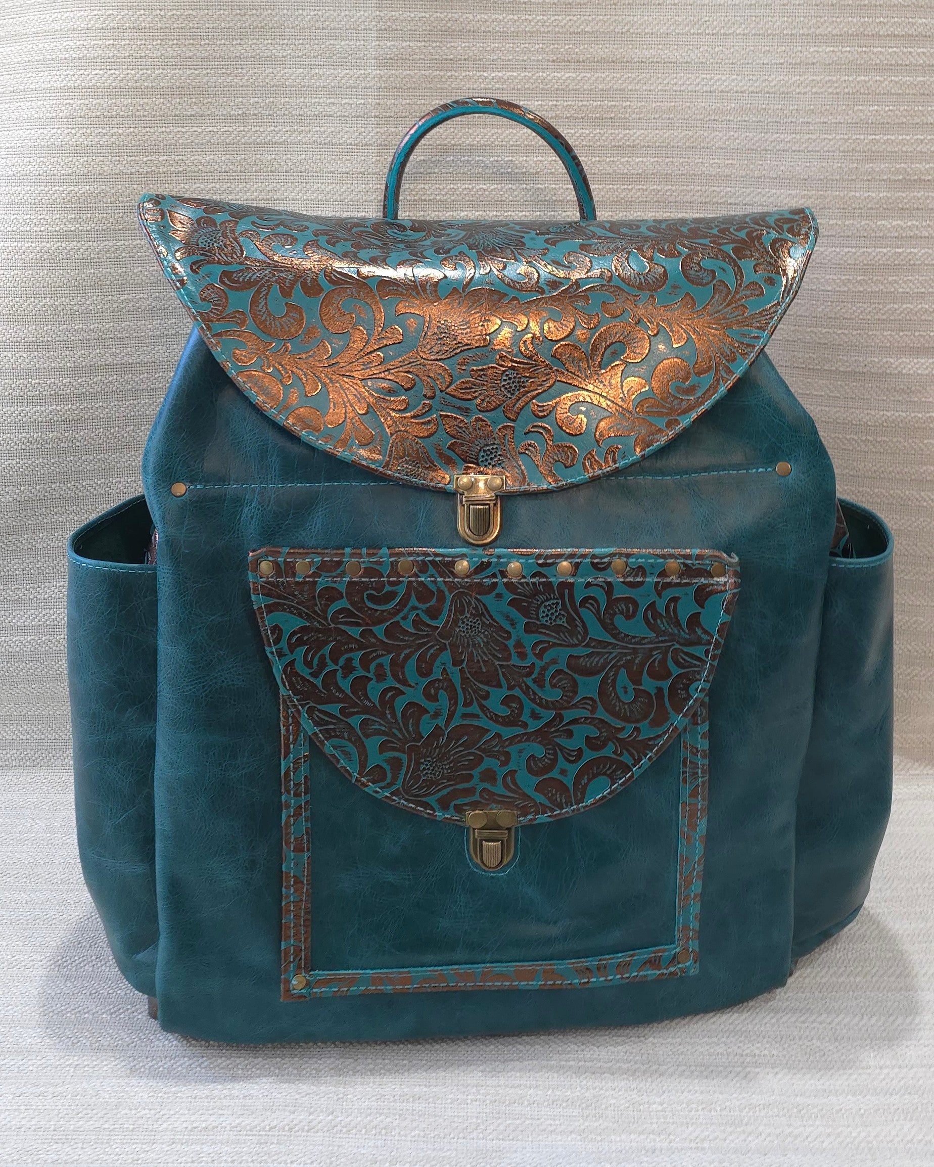 handmade leather teal and floral copper accent overnighter backpack bbk leather designs
