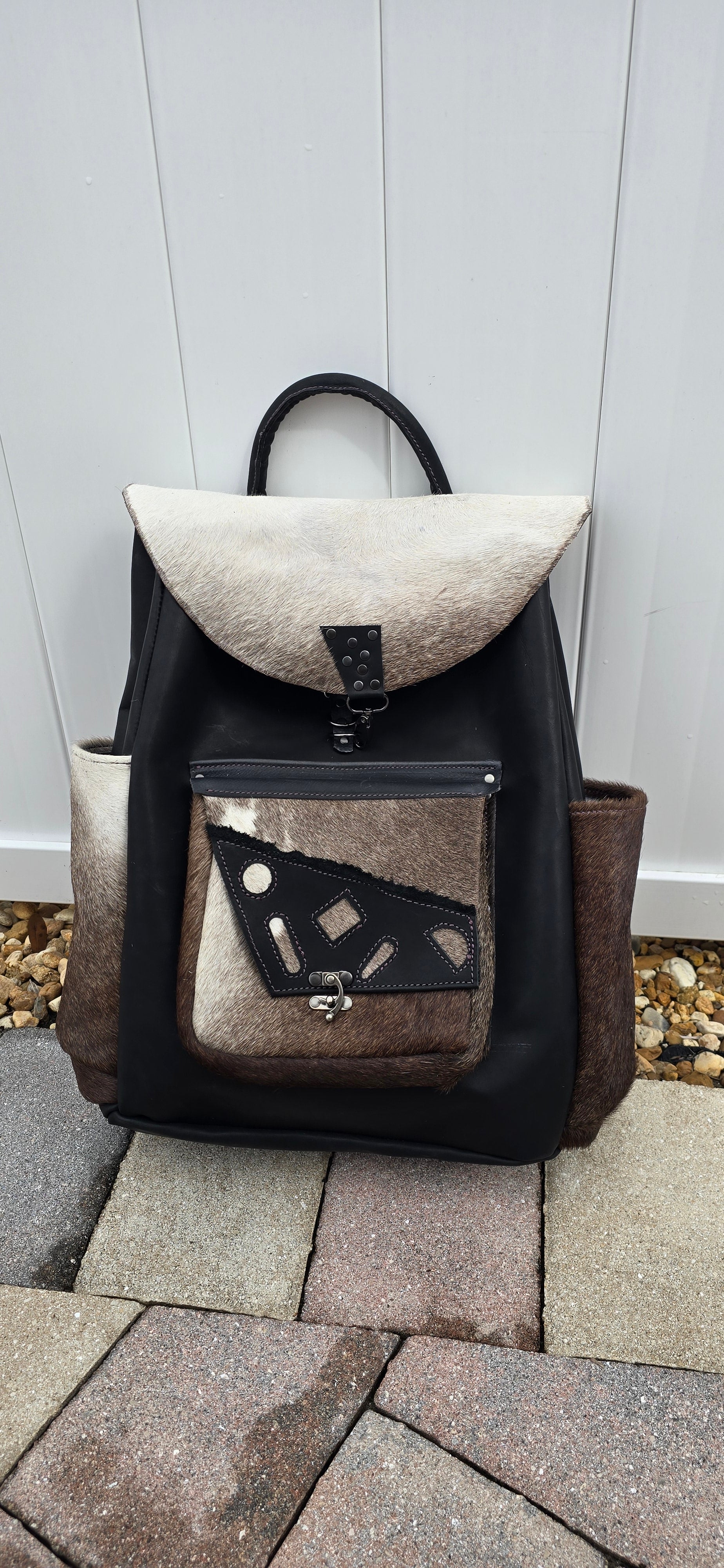 handmade leather black backpack with brown and tan fur flaps and pockets bbk leather designs