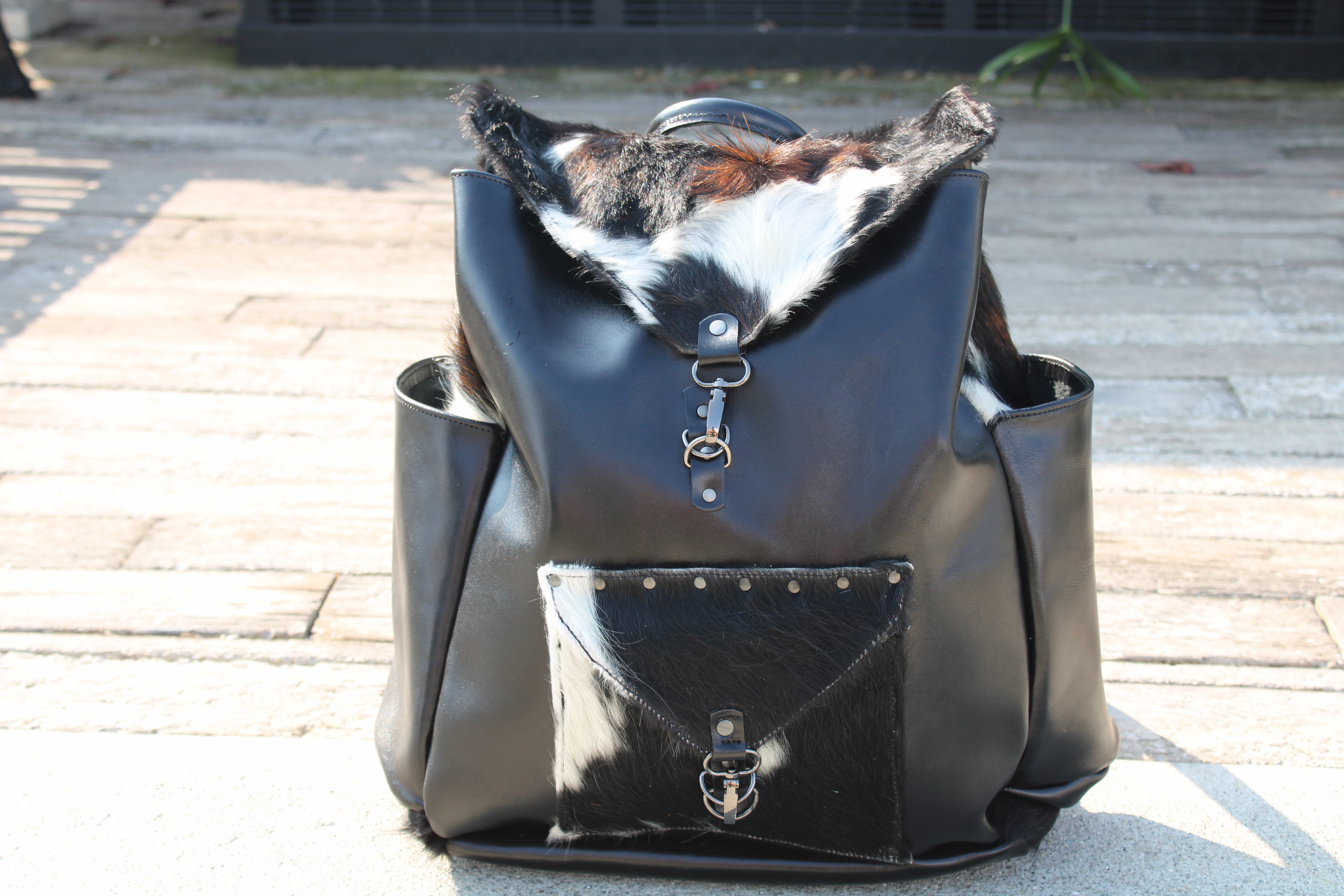 handmade leather black leather with calico fur accent overnighter backpack bbk leather designs
