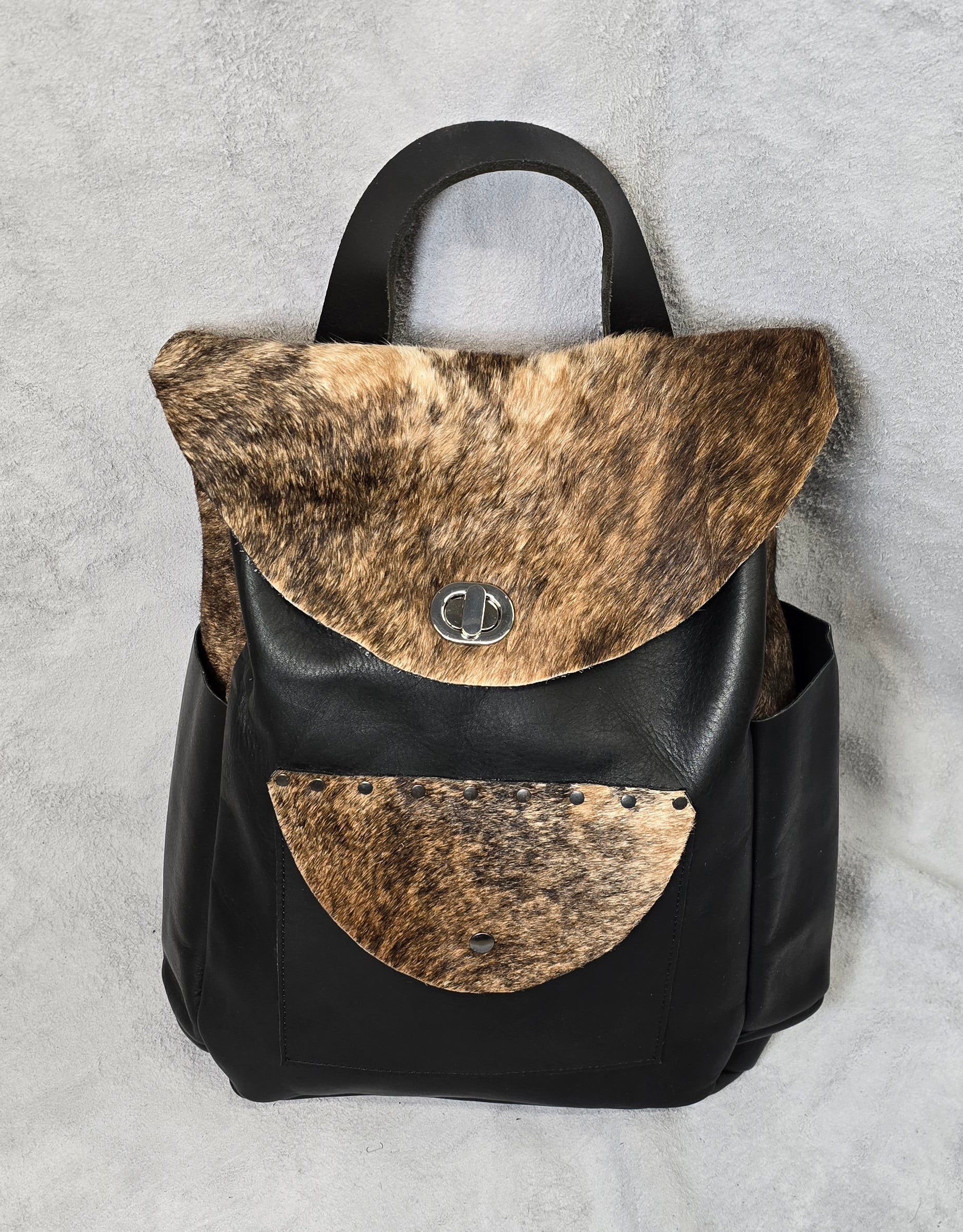 handmade leather lack and brindle fur overnighter leather backpack bbk leather designs