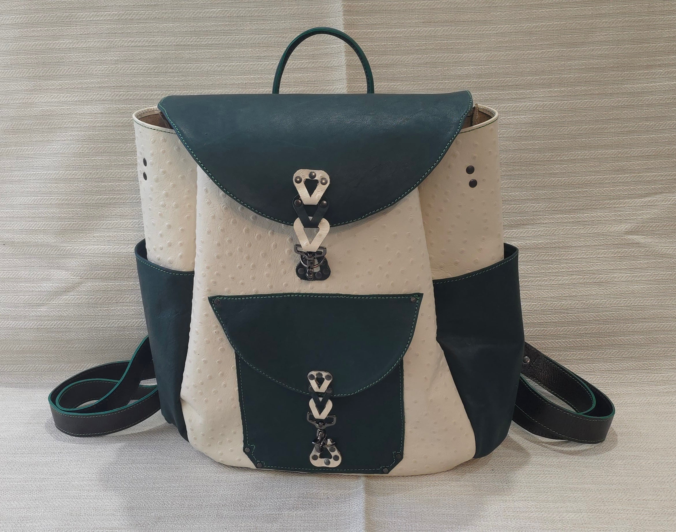 handmade leather embossed ostrich pattern cream and emerald green leather overnighter backpack bbk leather designs