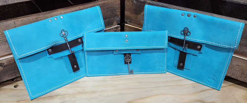 teal or turquoise handmade leather clutch bbk
